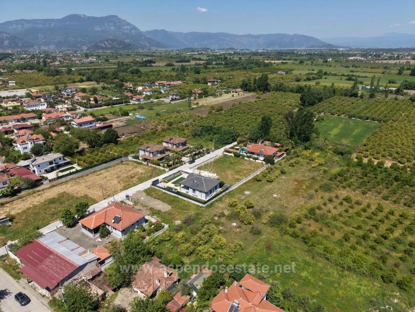 Land For Sale In Okçular, 1050M2, In The Village Residential Area.